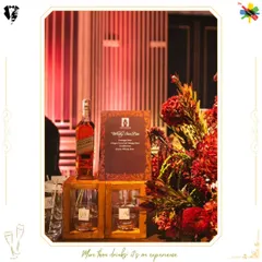 An elegant Whisky Sour Bar setup, beautifully decorated with lush red florals. This concept combines premium spirits with sophisticated design for a truly elevated experience.