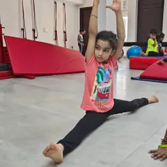 Look at this amazing progress. This young student is demonstrating a full front split, a result of consistent practice and flexibility training in my gymnastics class. I celebrate every milestone, big or small, because it builds a child's confidence for life.