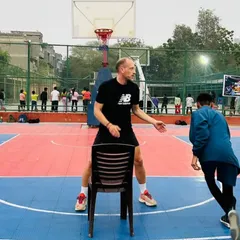 A professional coach from France leading a drill during our basketball clinic. We believe in learning from the best to enhance our players' skills.