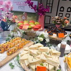 A complete hi-tea grazing table I set up for a workshop at a Bengaluru shopping mall. The spread includes mini pizzas, sandwiches, colorful sliders, and an assortment of desserts to keep the energy high.