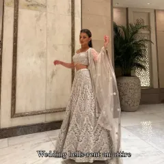 My gorgeous client dazzling in a heavy silver lehenga. She looks like a dream, twirling and shining at her event. This is the magic of renting luxury!