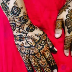 A close-up of a trending design with bold, dark lines and intricate details, set against a vibrant red background.