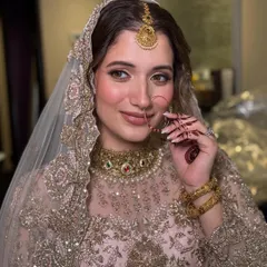 A stunning Nikkah bride with glowing skin and dreamy eyes. I used golden hues and a soft pink lip to create a timeless and elegant look that complements her intricately embroidered outfit.