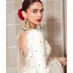 The back of this anarkali is just as stunning, with a deep back and beautiful tassels. We completed the look with a classic red rose in her hair for a touch of old-world romance.