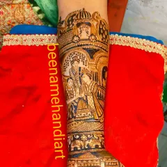 This is a close-up of a detailed portrait design on the forearm. I love capturing the fine details of the wedding attire and the emotions of the ceremony.
