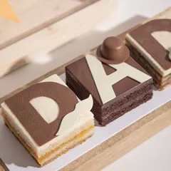 Our special Father's Day dessert, with handcrafted layers of cake spelling out "DAD". Each letter offers a different flavour, making it a unique and heartfelt gift.