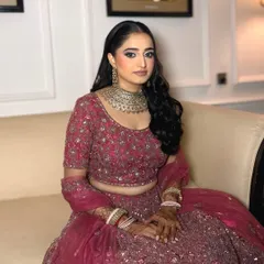 The complete reception look. The makeup perfectly complements her intricate lehenga and heavy jewelry without being overpowering.