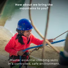 How about we bring the mountains to you? A young participant learns to handle ropes at our workshop. We provide a safe, controlled environment to master essential climbing skills.