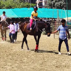 A young girl enjoys her guided ride during a club event. Our trainers are always on hand to lead the horses, giving parents peace of mind and kids a fantastic experience.