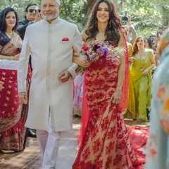 A father walks his daughter down the aisle. This proud and emotional moment between Shashi and Shibani is a cornerstone of any wedding day, a memory to be cherished forever.