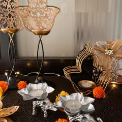 A collection of my festive T-light holders and decor. You can see the silver elephant T-lights, tall Hamsa holders, and other beautiful pieces that are perfect for illuminating your home during celebrations.