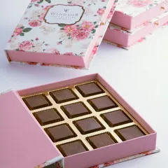 This beautiful floral-print box, shaped like a book, is filled with our smooth, soft-centered chocolates. It's an elegant and versatile gift option suitable for any occasion, from corporate thank-yous to personal celebrations.