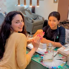 Actress Zoya Afroz looking radiant while getting a manicure at our salon. She chose a beautiful bright pink shade for her nails.