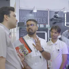 Our team engaging with visitors at the Smart Home Expo. We believe in having detailed conversations to understand our clients' needs and explain our technology.
