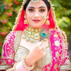 An outdoor bridal portrait using natural light. The soft background and focus on the subject's expression create a timeless and elegant feel.