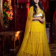 Actress Rachana Inder looking radiant in my yellow tiered lehenga for a Diwali shoot. This shows how my outfits are perfect for festive photoshoots and celebrations.
