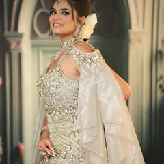 This heavily embellished gown is perfect for a grand reception. I paired it with a sophisticated updo, a white rose, and glamorous makeup.