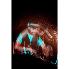 An artistic long-exposure shot that captures the motion and energy of DJing. The lights and movement represent the dynamic sound I create.