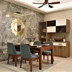 A cozy dining nook with a beautiful marble-finish accent wall. The custom crockery unit provides ample storage while the sunburst mirror adds a touch of glamour.