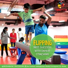 With expert coaching, every child can flip into success. Here, one of our dedicated coaches provides hands-on support, ensuring safety while helping a student master their balance on the beam.