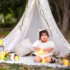 Surrounded by light and wonder. This enchanting outdoor setup is perfect for creating storybook memories.