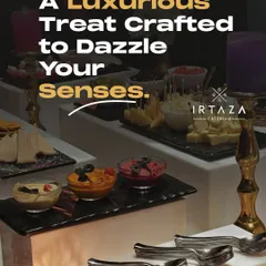 A luxurious appetizer spread featuring various dips like hummus, along with cheese and olives. The presentation on multi-level black slate platters, accented by golden candelabras, adds a touch of modern elegance.