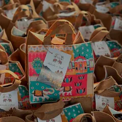 There's nothing like a warm welcome at a destination wedding. I created hundreds of these vibrant, Rajasthani-themed jute bags filled with snacks and goodies to welcome guests. It’s the perfect way to get the celebration started.