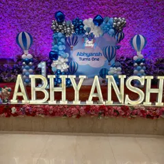 Large, illuminated marquee letters spelling out the birthday boy's name are a fantastic centerpiece for any stage setup. Here they are part of a Hot Air Balloon theme.