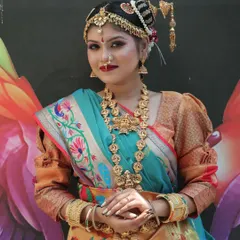 This shot captures the elegance of a South Indian bride against a vibrant backdrop. I guide my students on how to create makeup that complements both the outfit and the environment for stunning photography.