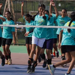 Our girls' team celebrating a point during a training drill. We foster a positive and energetic atmosphere where players can thrive.
