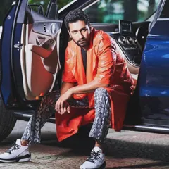 Another look from my shoot with Vicky Kaushal. This striking orange leather jacket paired with snakeskin print pants was a powerful, high-fashion statement that he pulled off effortlessly.