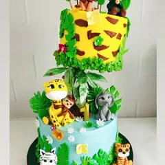 Welcome to the jungle! This gravity-defying cake was a joy to create for a little explorer's first birthday. Every animal is handcrafted from fondant, and the floating tier adds a touch of wild magic to the celebration.