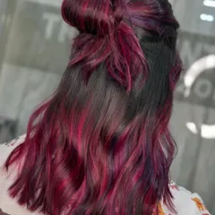 A cute half-up bow style showcasing the vibrant pink and violet hues. This demonstrates how fun and versatile bold colors can be.
