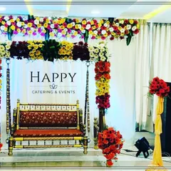 Another elegant swing decoration for a naming ceremony or baby shower. This setup features a rich floral arrangement overhead and flower-wrapped chains, set against a simple white drape to make the colors pop.
