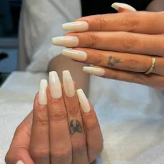 Simplicity meets elegance with these milky white Gel-X nails. This semi-sheer white provides a clean, fresh, and modern look on long, coffin-shaped nails.