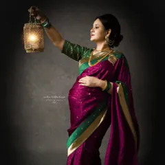 A self-portrait from my own maternity journey in a traditional Paithani saree. Holding a lantern, this pose has a classic, old-world charm.