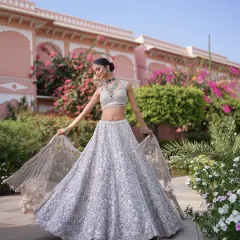 A fairytale moment in a shimmering silver lehenga. I love creating dreamy, modern looks that feel light, magical, and perfect for a bride who wants to twirl the night away. It’s all about capturing that feeling of effortless grace.