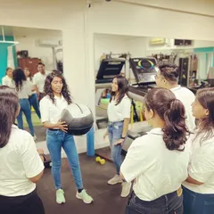 Continuous learning is a core value at Arch. A team member leads a practical session, ensuring we are all proficient in the latest exercise methodologies to better serve our clients.