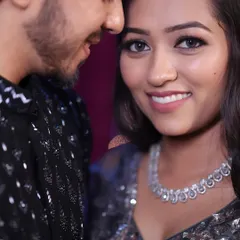A close-up of the Sangeet couple. Her makeup is soft yet glamorous, with a focus on luminous skin that looks incredible in the evening lights.