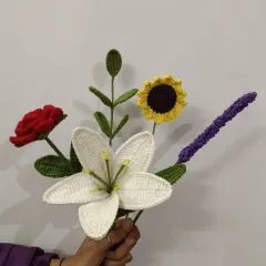 A beautiful, handcrafted bouquet of crochet flowers, including a lily, rose, sunflower, and lavender. This is a thoughtful and sustainable gift for Women's Day or any special occasion.