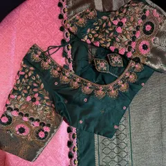 Another view of the green floral blouse, showing the detailed craftsmanship on the sleeves and the delicate tassels along the back opening. Every element is carefully considered to create a cohesive design.