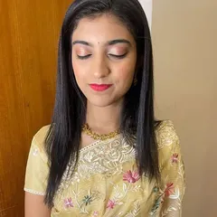 A close-up of the soft and simple makeup. The light shimmer on the eyes and the bold lip create a balanced and beautiful look.