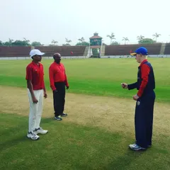 A close-up of the captains' interaction before the game begins. This highlights the competitive yet respectful environment we foster in our youth cricket programs.