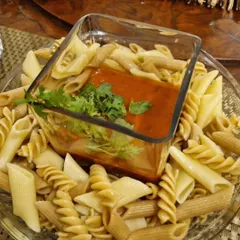 A deconstructed presentation of our Penne Pomodoro. We serve the pasta and our slow-cooked tomato and basil sauce separately, so you can mix them to your liking.