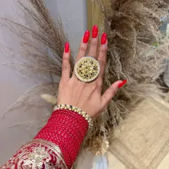Diwali-ready nails. A classic, vibrant red manicure is the perfect accessory to complete your traditional festive look.