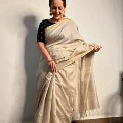 The golden beauty, Rashmi. For this look, I created a classic, elegant style with a simple bun and makeup that highlights her graceful features.