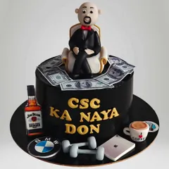 A fun "Naya Don" cake for a celebration of success. This cake features a fondant figure, edible money, and icons of luxury like a BMW logo and Jim Beam bottle.