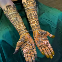 The full story. Her passion for Kathak dance is shown with ghungroos, and his love for photography with a camera. A beautiful way to represent two passions becoming one love.