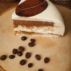 A slice of my Tiramisu, showing the slow embrace of coffee and Baileys, layered with depth and warmth.