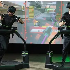 A clear shot of the Virtuix Omni installation, showcasing the safety harness and ring that allows users to move freely and safely within the virtual environment.